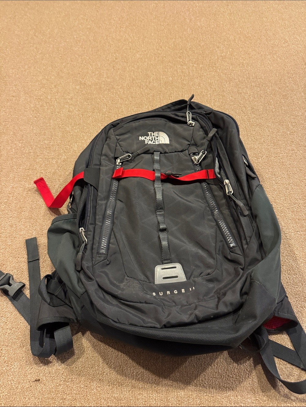 The North Face Black Backpack with Red Strap Details